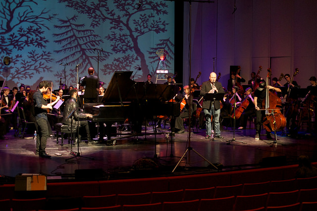 Orchestra and soloists performing Three Musketeers concerto