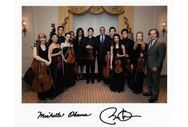 The musicians standing with the President and First Lady