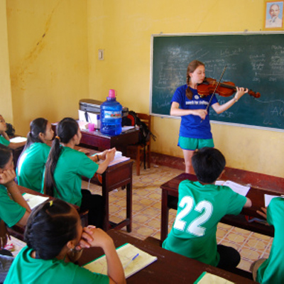 Devon performs for students in Vietnam, modeling how hard work can pay off in the long run.