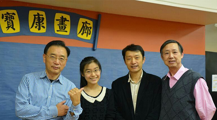 Youlan with her dad Jie Ji, the center's owner Baoli Zhang, and Weixiong Li