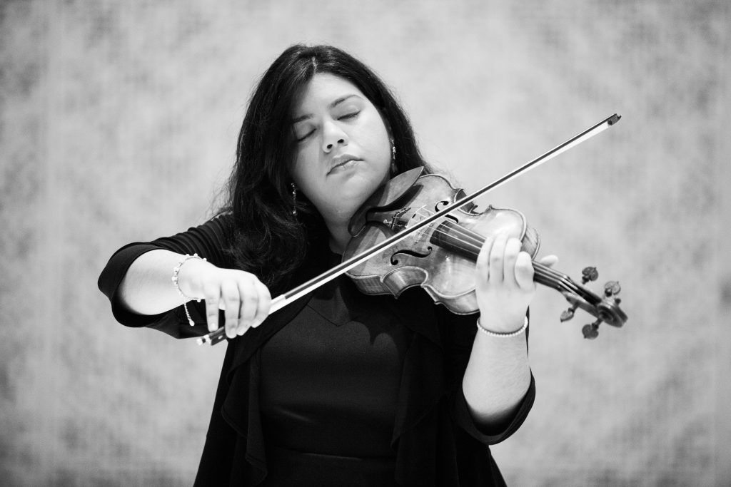 Arts Leadership grant winner Karen Cueva plays her violin