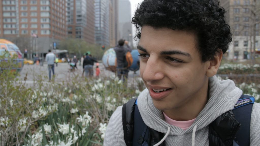 Amir Siraj sits in a New York City park